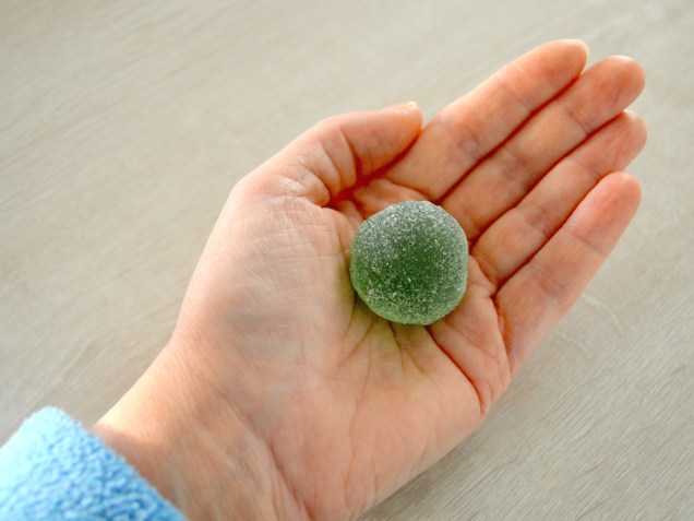 Green Ball jelly candy in Hand